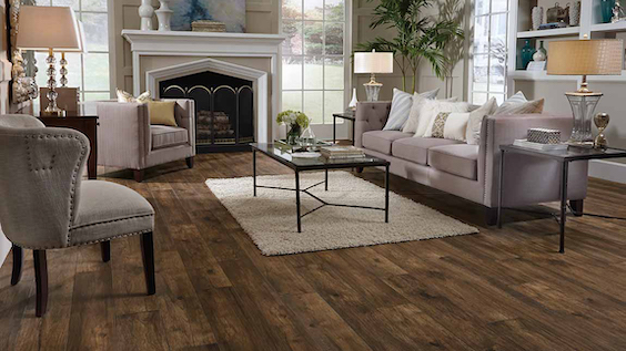 gorgeous dark stained wood look laminate flooring in a living room